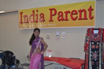 Kushi Fashions model Sindhu posing in front of IPMs Banner